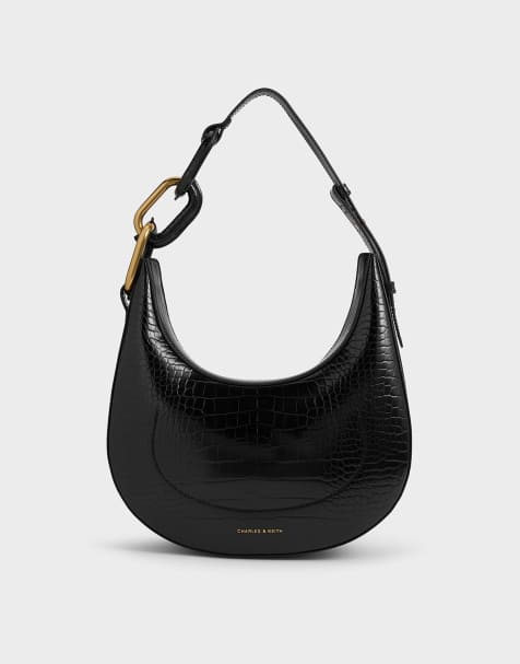 Charles & Keith Kora croc-effect metallic-accent moon bag in black - view 1