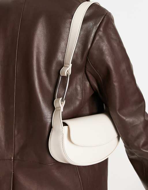 Charles & Keith – Krämfärgad, rundad axelremsväska