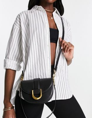 Charles & Keith small crossbody bag with gold clasp in black | ASOS