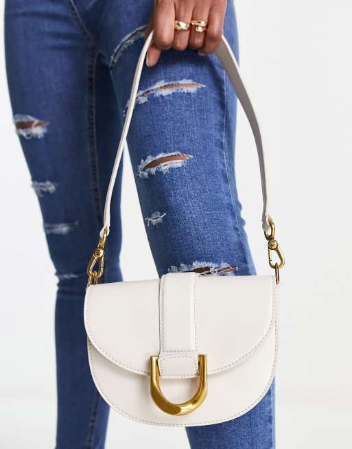 Charles Keith small crossbody bag with gold clasp in off white