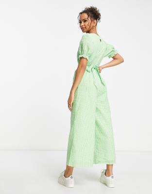 Charlie Holiday plunge neck jumpsuit in green | ASOS