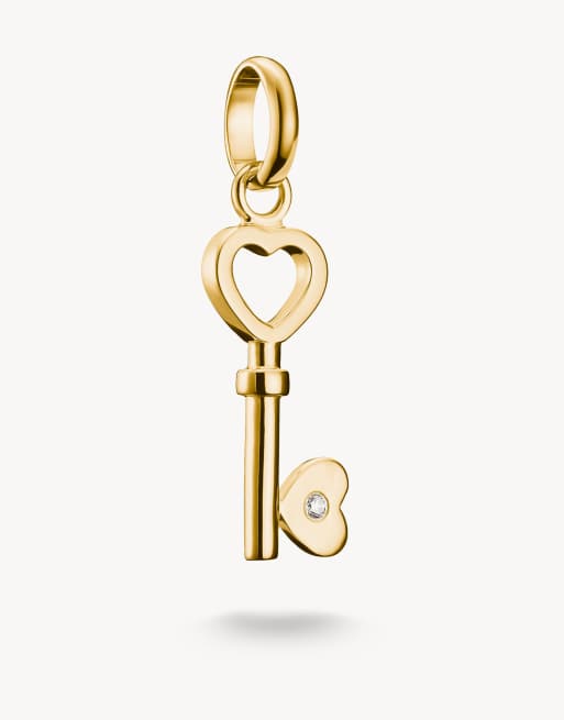 Charm color oro amarillo y blanco con diseño de llave con terminaciones de corazón Connect de Thomas Sabo