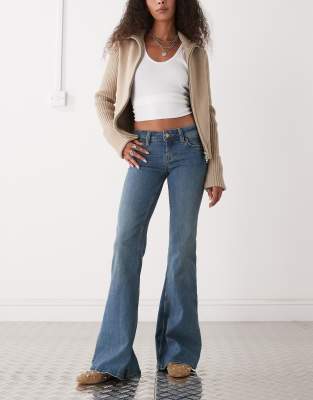 Cheap Monday - Jean évasé stretch taille basse - Bleu