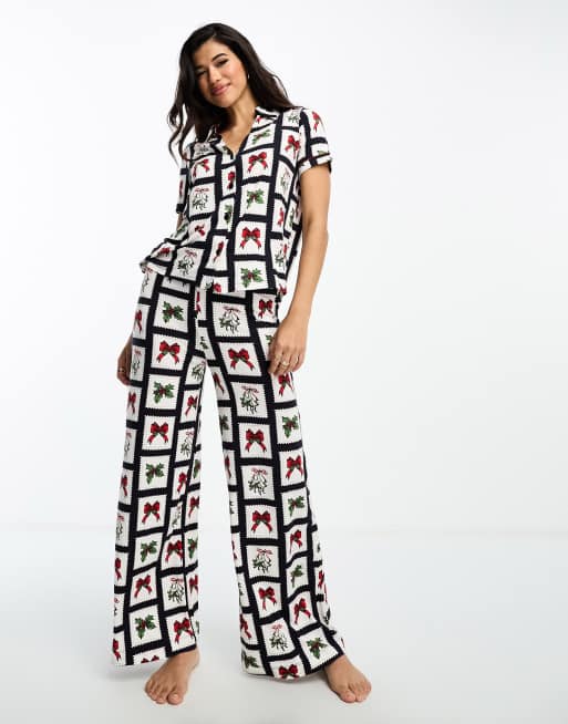 Chelsea Peers christmas bows wide leg pyjamas in navy and white