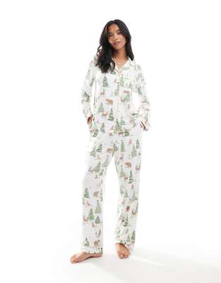 Chelsea Peers Petite Chelsea Peers Exclusive Petite Christmas print long sleeve top and trouser pyjama set in cream-White