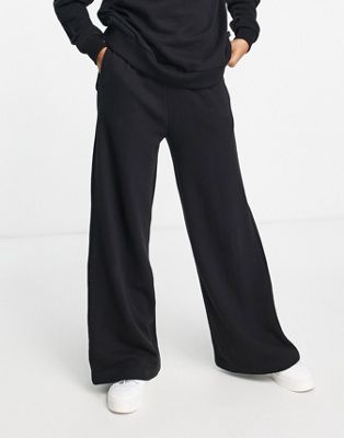 Chelsea Peers high waist wide leg joggers with woven logo tab in black