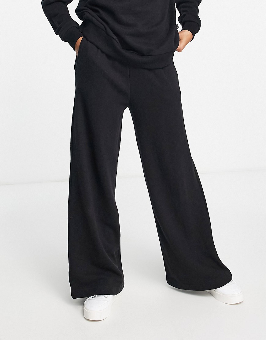 Chelsea Peers high waist wide leg sweatpants with woven logo tab in black