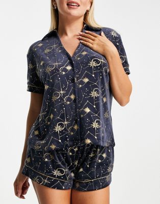 Chelsea Peers velvet revere top and short pyjama set with gold foil print in navy | ASOS