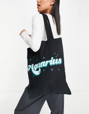 фото Черная хлопковая сумка-шопер с надписью "aquarius" и принтом звезд asos design-черный цвет