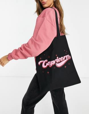 Черная хлопковая сумка-шоппер с надписью "Capricorn" ASOS DESIGN - Что дарить девочке подростку