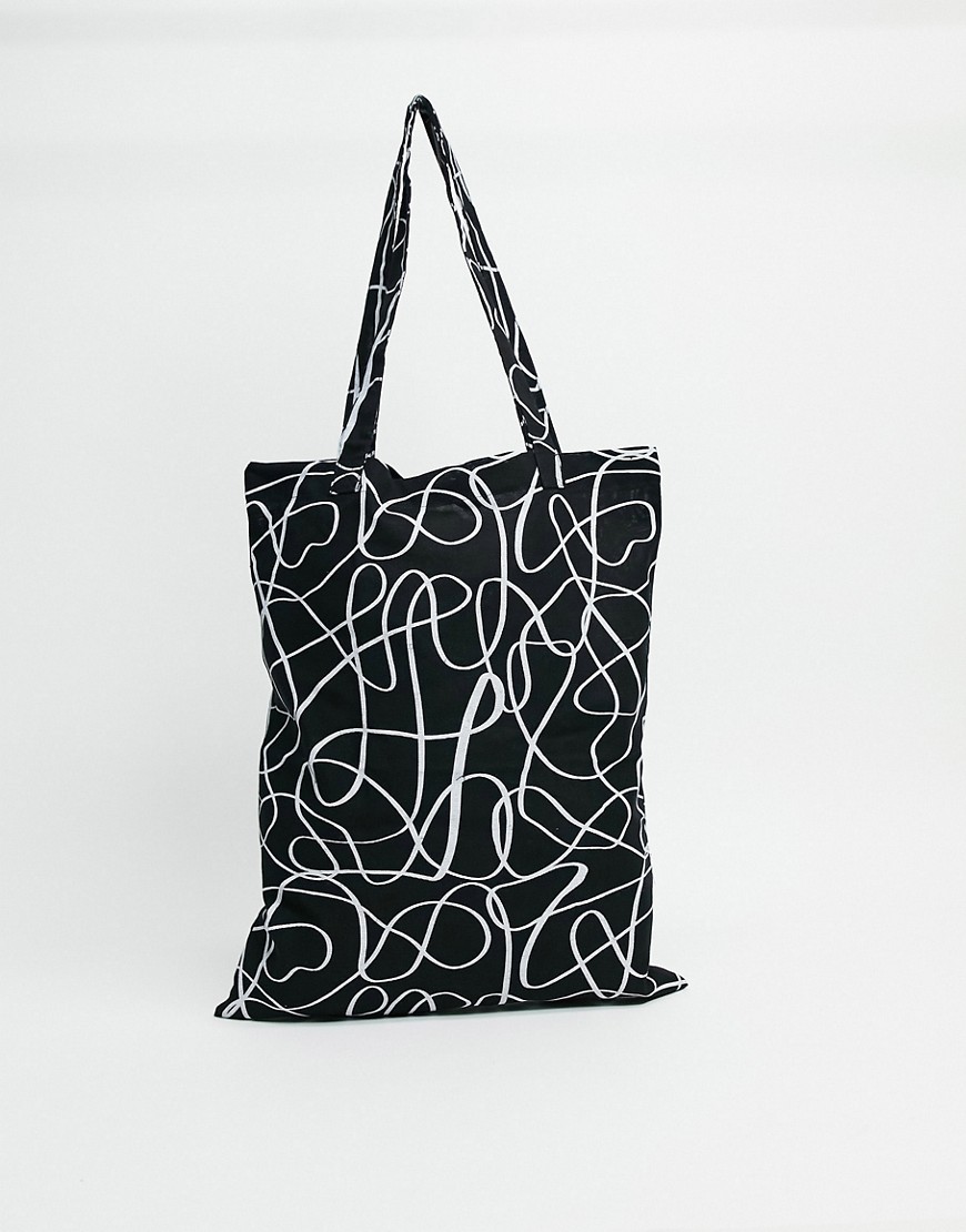 фото Черная сумка-тоут из плотной ткани с фигурным принтом asos design-черный цвет