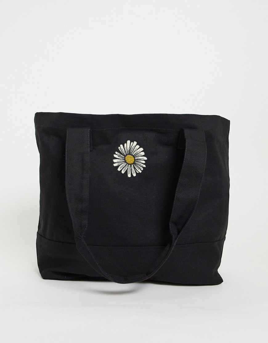 фото Черная сумка-тоут в стиле oversized из плотной моющейся ткани с вышивкой маргаритки в стиле 90-х asos design-черный цвет