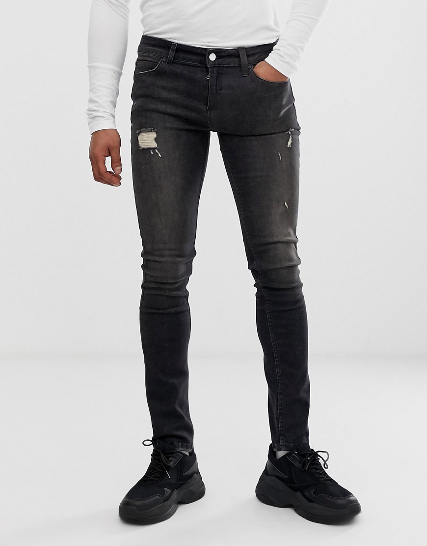 фото Черные джинсы скинни с рваной отделкой religion-черный