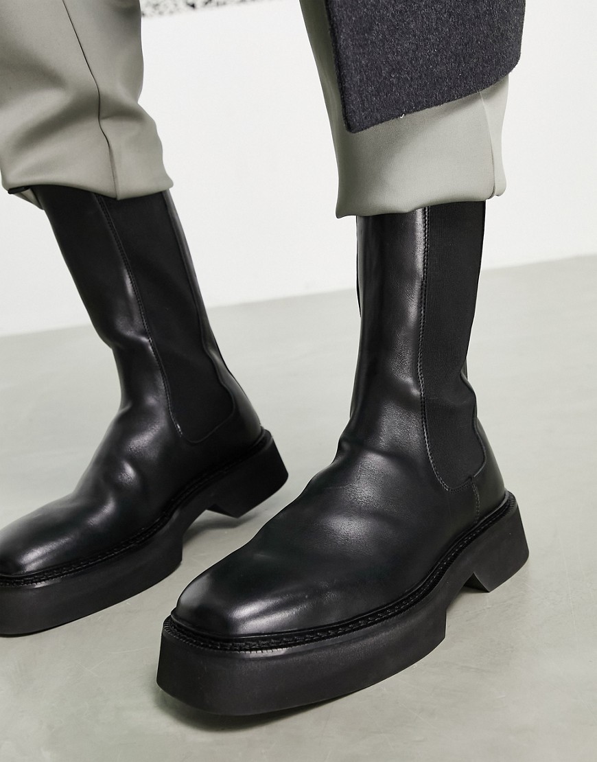 фото Черные кожаные ботинки челси до середины икры на толстой подошве asos design-черный цвет