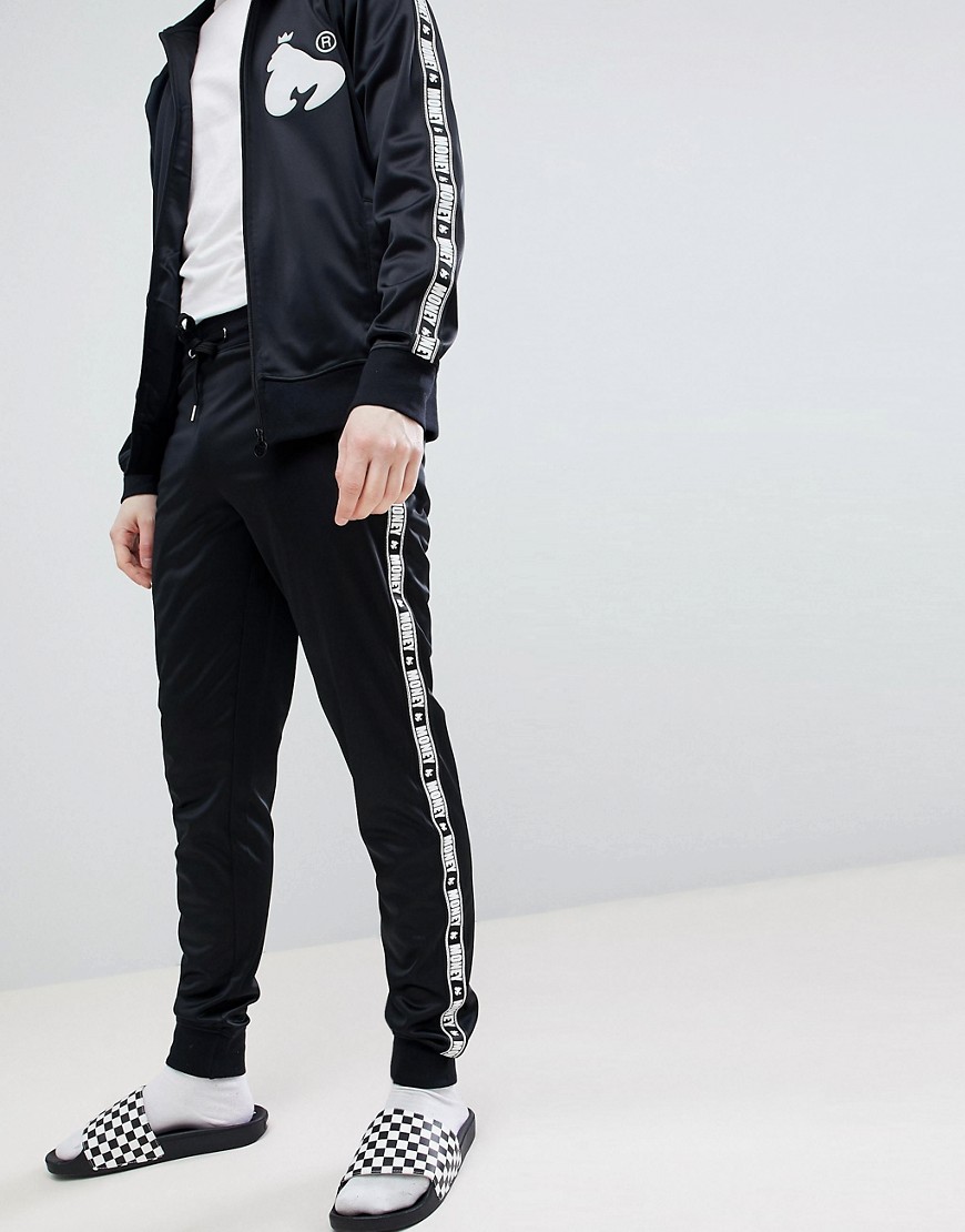 фото Черные спортивные штаны с контрастными полосками по бокам money-черный