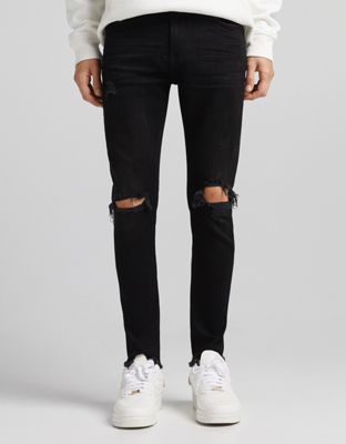 фото Черные супероблегающие джинсы с прорехами bershka-черный цвет