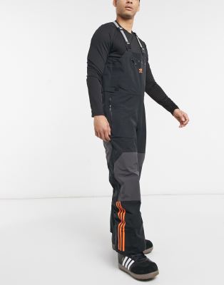 фото Черные зимние брюки-комбинезон adidas snowboarding 3l-черный цвет