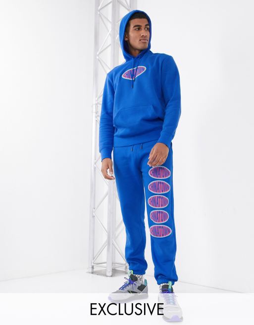 Chinatown Market Oval logo sweatpants in blue