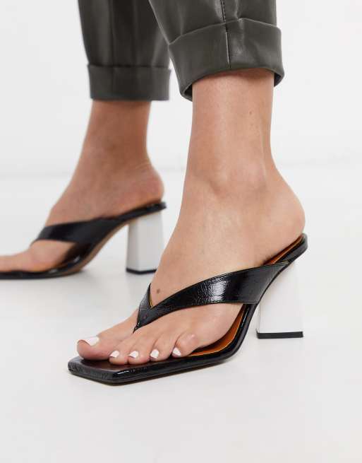 Chio mules with toe post in black leather