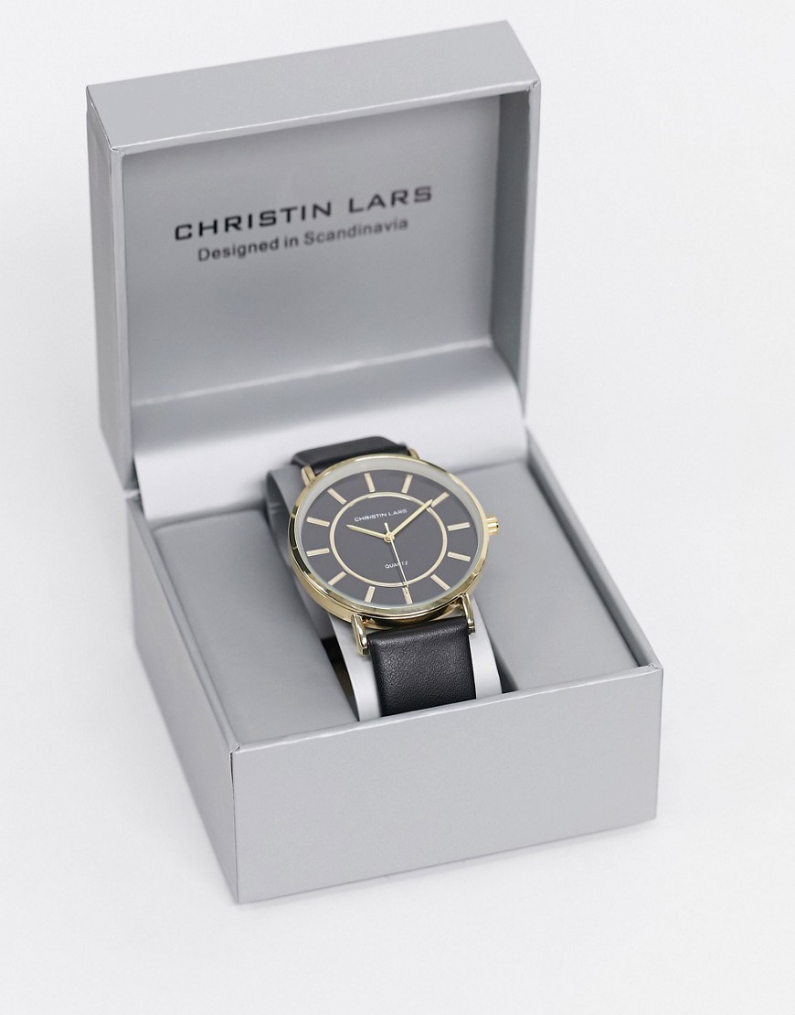 Christin Lars slimline watch with black leather strap and gold dial