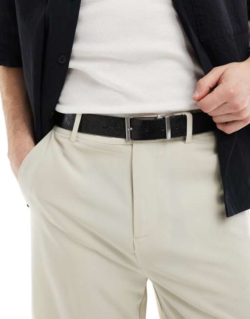 Cinturón negro reversible liso y efecto piel de lagarto de cuero sintético de ASOS DESIGN