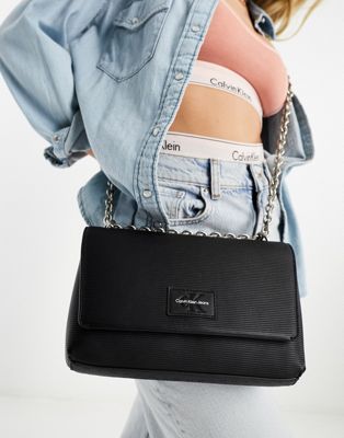 CK Jeans sculpted flap chain cross body bag in black - ASOS Price Checker