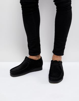 all black wallabees