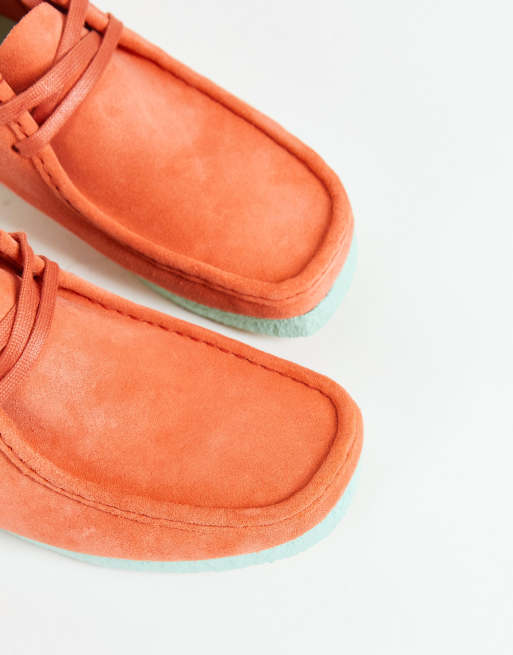 Clarks store wallabee coral