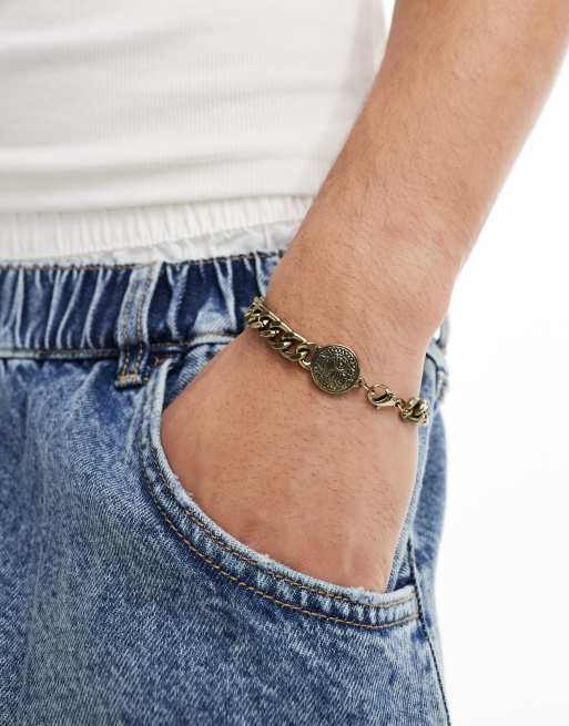 Classics 77 - Bracciale color oro a maglie con sole inciso
