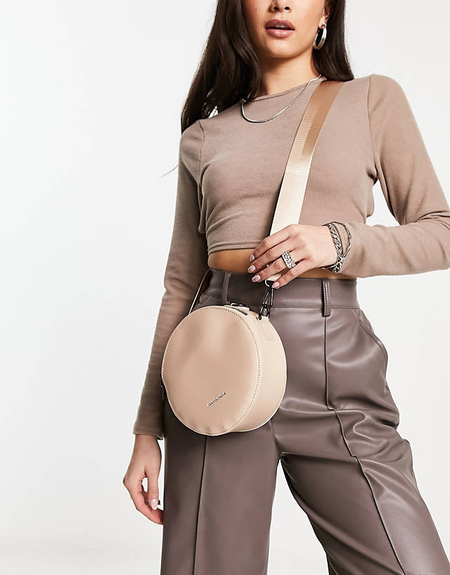 Claudia Canova - circle cross body bag with rope detail handle in taupe