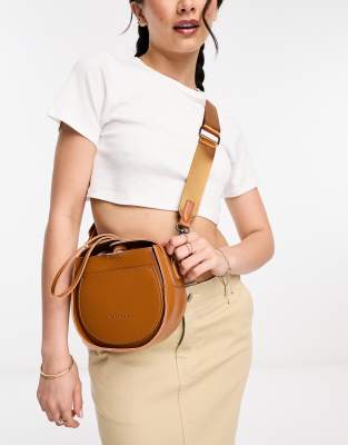 Claudia Canova circle cross body bag with wristlet detail in tan