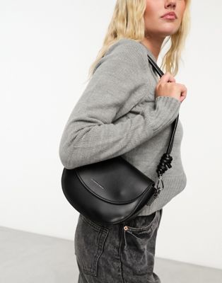 Claudia Canova crescent saddle bag with knot strap detail in black - ASOS Price Checker