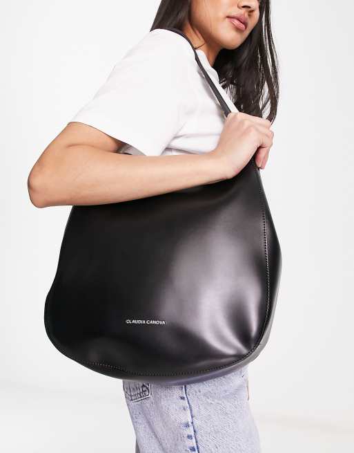 Claudia Canova curved shoulder bag with cross body strap in black ASOS