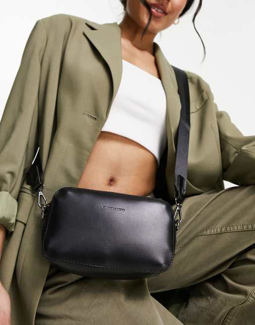 Claudia Canova – Czarna torebka z rączką z liny i paskiem crossbody