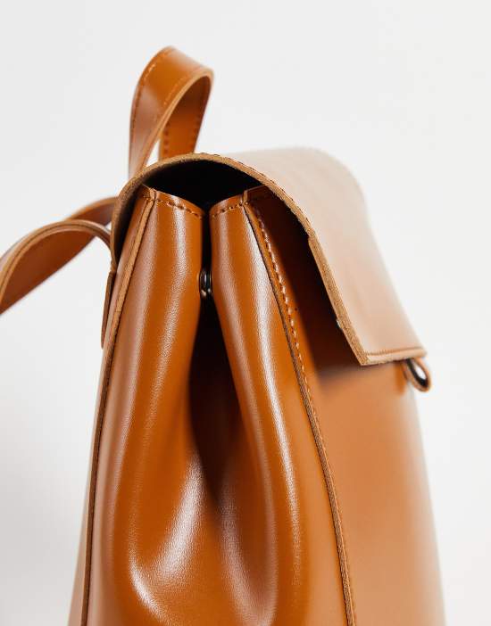 https://images.asos-media.com/products/claudia-canova-diagonal-flap-backpack-in-tan/202025794-4?$n_550w$&wid=550&fit=constrain