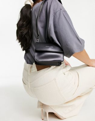 Claudia Canova mini flap top shoulder bag with contrast binding in black - ASOS Price Checker
