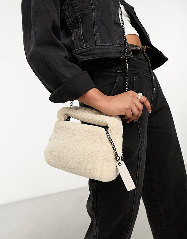 Claudia Canova - mini grab bag with cross body strap in beige faux fur