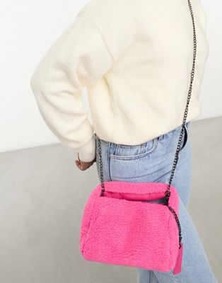 Claudia Canova mini grab bag with cross body strap in pink faux fur