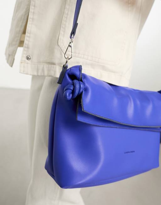 Claudia Canova slouchy clutch bag in blue | ASOS