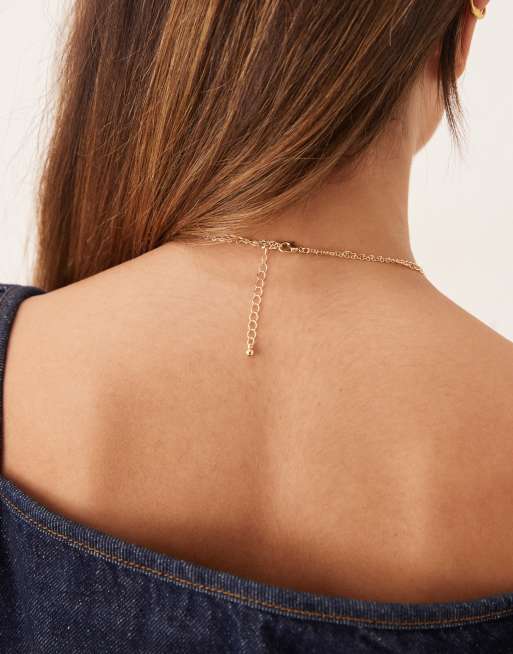 Collar de varias hileras dorado de estilo lariat con adornos de gemas de imitación de ASOS DESIGN, 3 de 3