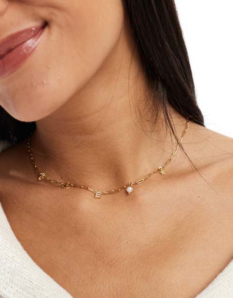 Collar dorado con charms celestiales y letra E chapado en oro de la colección Z de Accessorize - view 1