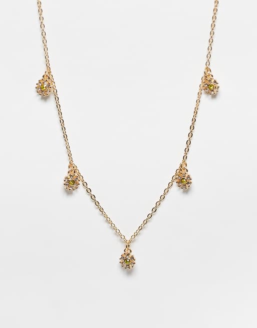 Collar dorado con charms margaritas con cristales de ASOS DESIGN | ASOS