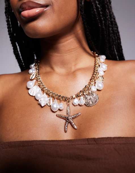 Collar dorado con charms grandes de conchas y estrella de mar Rivierra de ALDO - view 1
