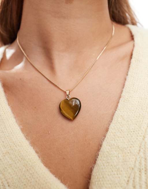 Collar dorado con colgante en forma de corazón de ojo de tigre de ASOS DESIGN