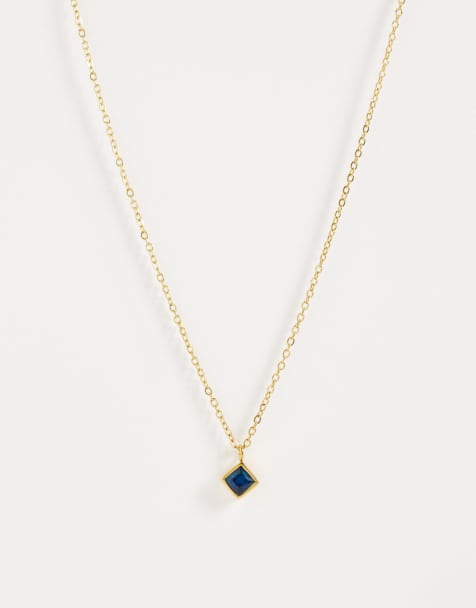 Collar dorado de acero inoxidable resistente al agua con colgante de circonita azul zafiro de ASOS DESIGN - view 1