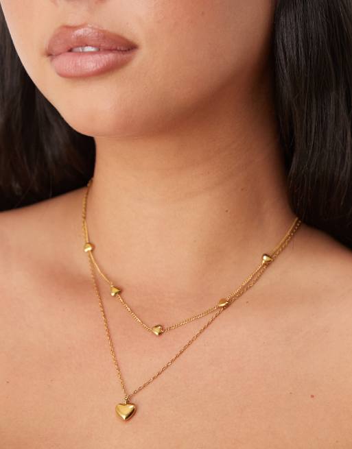 Collar dorado de varias hileras con colgantes de corazones de acero inoxidable resistente al agua de ASOS DESIGN Curve