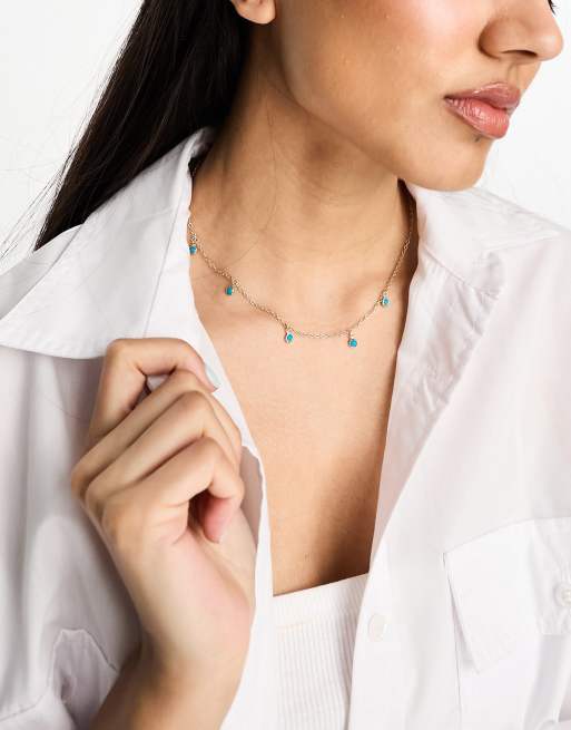 Collar estilo gargantilla dorado con colgantes turquesas de DesignB London