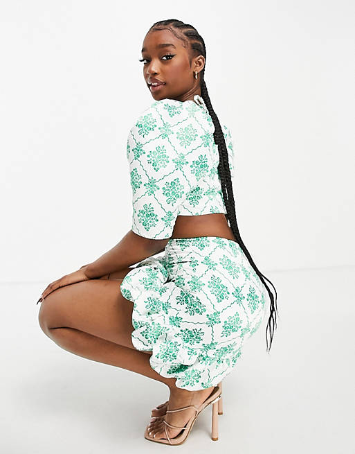 Collective the Label bubble hem mini skirt co-ord in green jewel print
