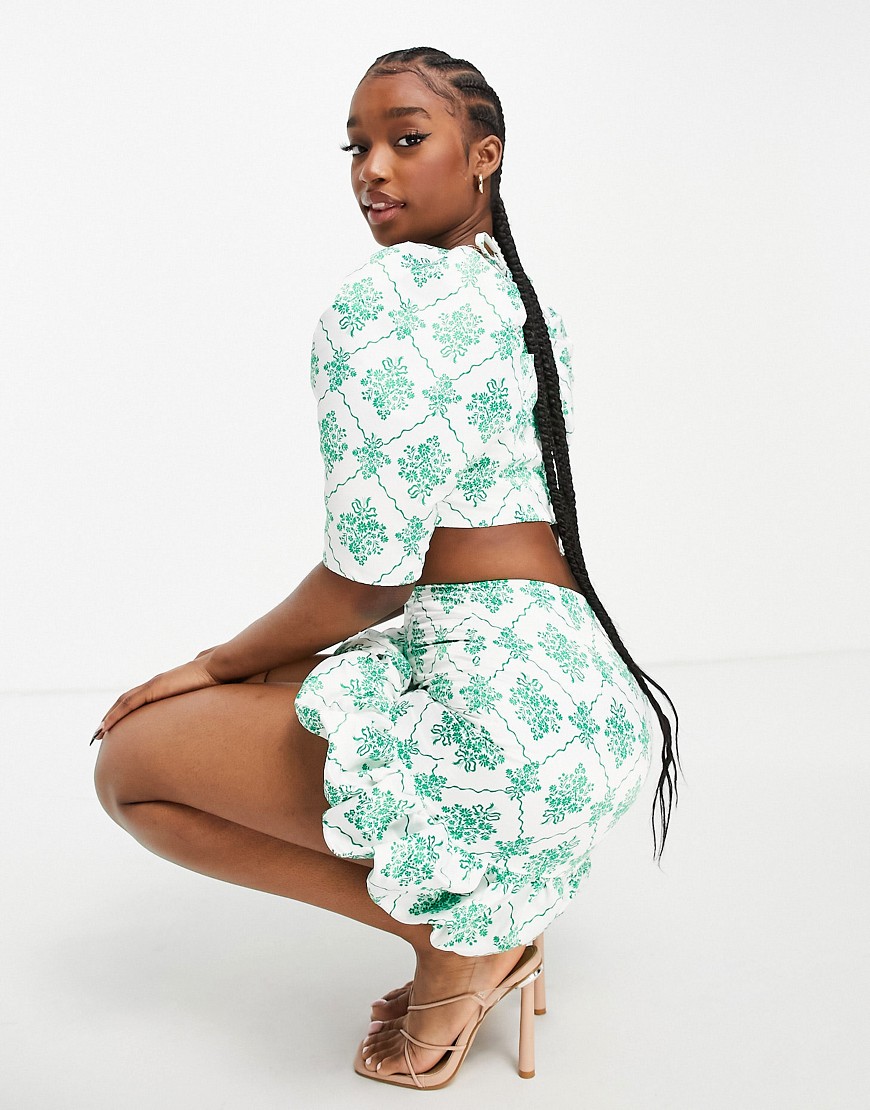 Collective the Label bubble hem mini skirt set in green jewel print
