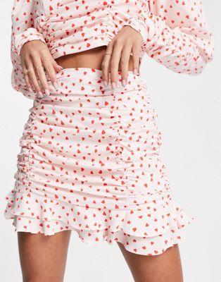 Collective the Label exclusive ruched frill mini skirt co-ord in heart print